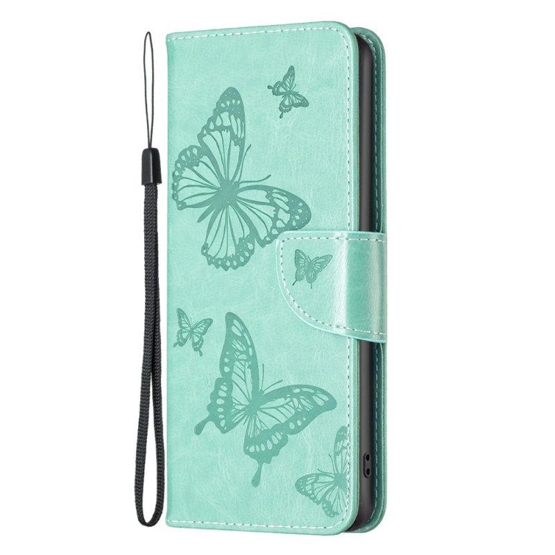 Flip Case Für Samsung Galaxy M23 5G Mit Kordel Riemchen Mit Schmetterlingen-print