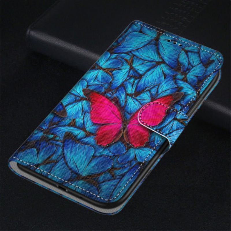 Lederhüllen Xiaomi Redmi 10 Handyhülle Roter Schmetterling Auf Blauem Hintergrund