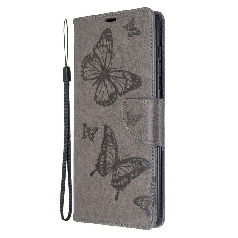 Lederhüllen Samsung Galaxy A71 Grau Schmetterlinge Im Flug Mit Tanga