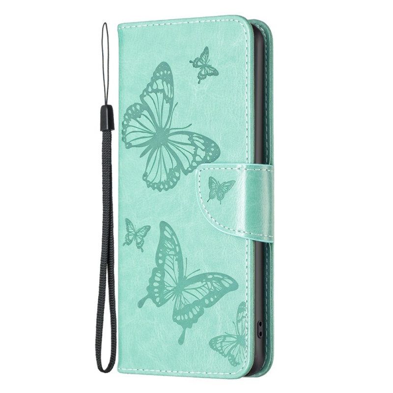 Flip Case Für iPhone 14 Pro Max Mit Kordel Riemchen Mit Schmetterlingen-print