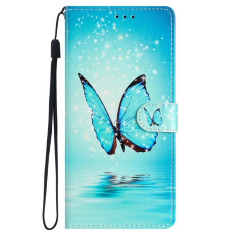 Lederhüllen Für iPhone 15 Mit Kordel Blauer Schmetterling Im Flug Mit Riemen